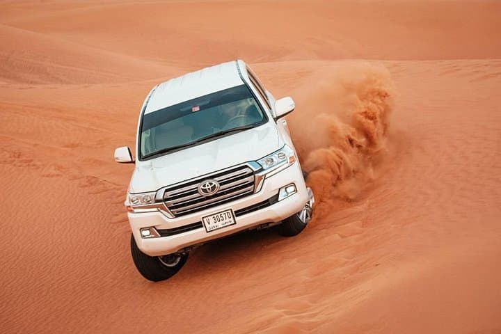 Evening Desert Safari Dubai: Dune Bashing, Camel Ride & BBQ Under the Stars photo 1