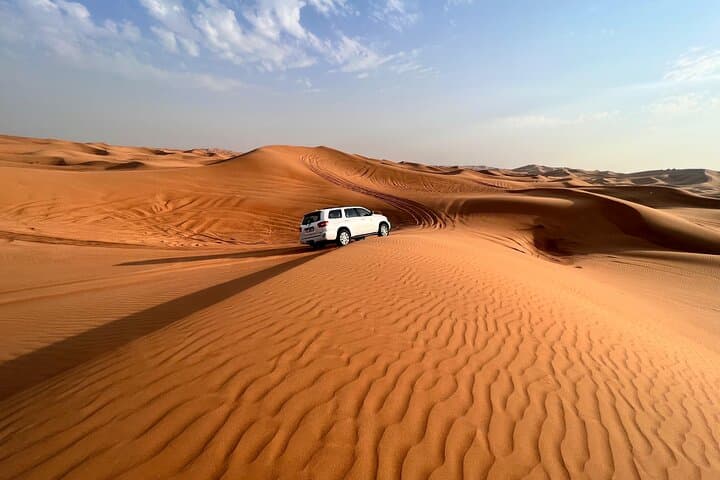 Evening Dubai Desert Safari: Red Sand Dune Bashing, Camel Rides & Premium Camp