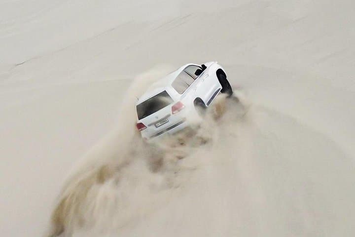 Half-Day Doha Desert Safari — Sunrise & Sunset Dune Bashing, Sandboarding and Camel Ride