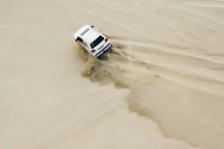 Half-Day Doha Desert Safari — Sunrise & Sunset Dune Bashing, Sandboarding and Camel Ride photo 3