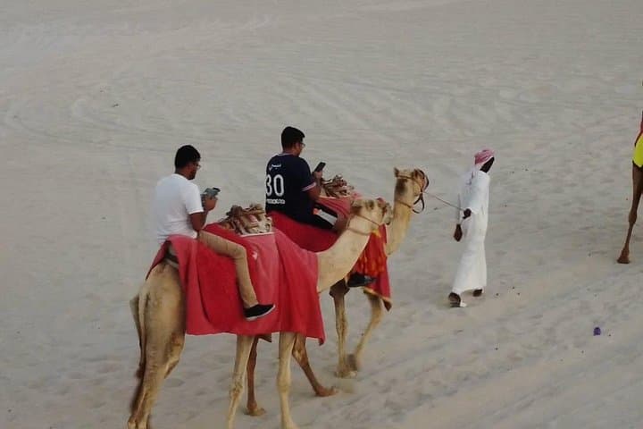 Half-Day Doha Desert Safari — Sunrise & Sunset Dune Bashing, Sandboarding and Camel Ride photo 4