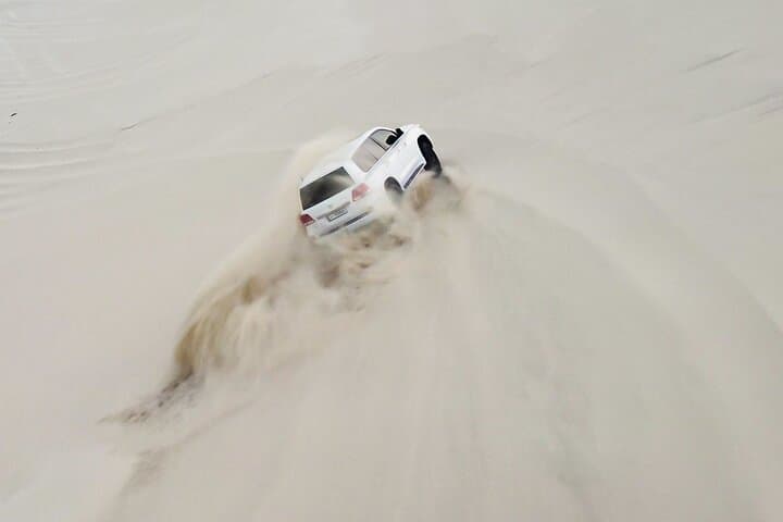 Doha Desert Half-Day Safari: Dune Bashing, Camel Ride & Sandboarding