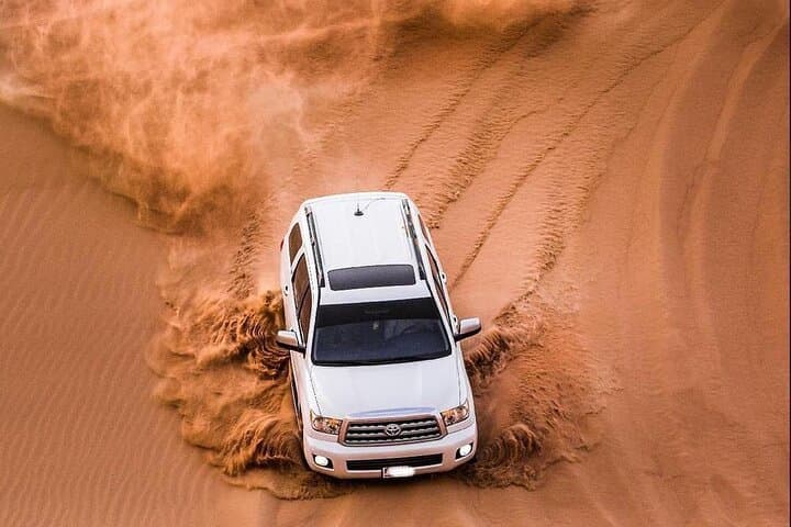 Arabian Desert Safari in Dubai: Dune Bashing, BBQ Dinner & Live Shows