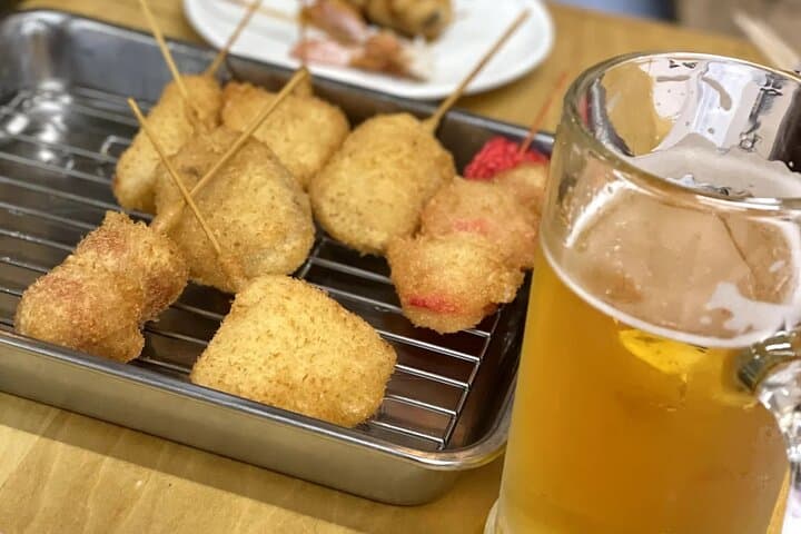 Hidden Osaka: Yukaku Red-Light District & Shinsekai Culinary Walking Tour photo 5