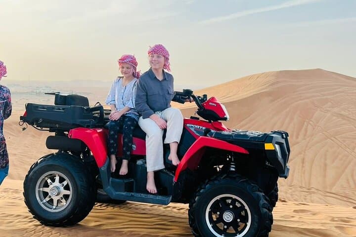 Dubai Evening Desert Safari: Quad Bike ATV, Camel Ride & BBQ Experience photo 2