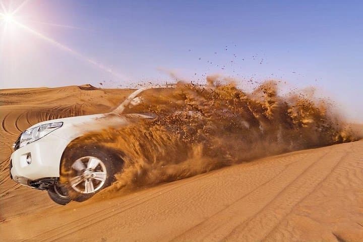 6-Hour Desert Safari in Dubai: Dune Bashing, Sandboarding & Live Shows