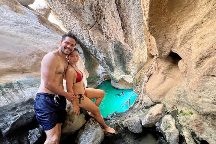 Full-Day Wadi Shab and Bimmah Sinkhole Tour from Muscat: Hike, Swim, and Hidden Caves