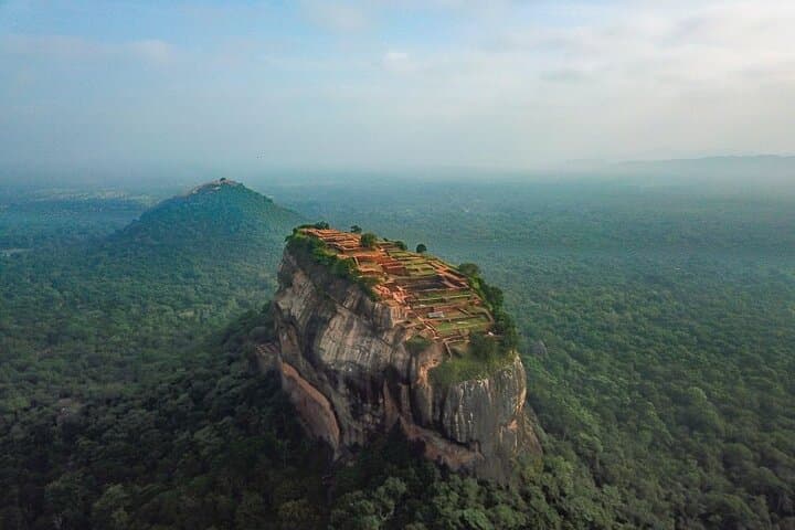 Kandy to Anuradhapura Shuttle & Dambulla Sightseeing — Sigiriya Rock, Dambulla Cave Temples & Village Paddle photo 4