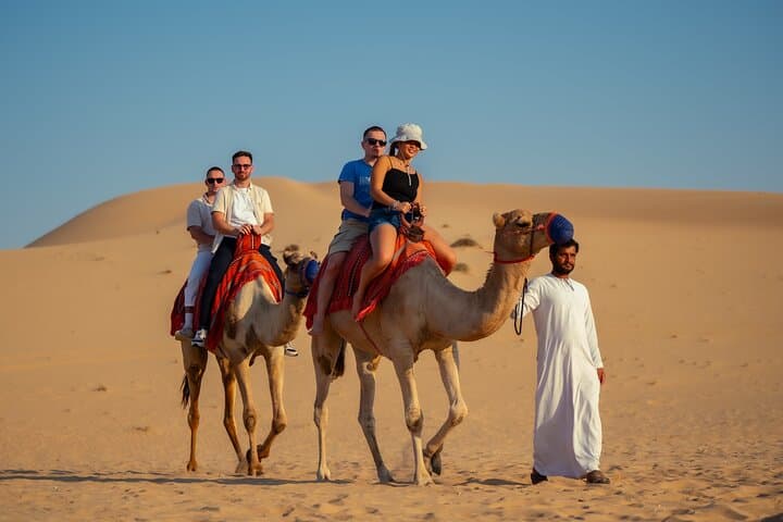 Abu Dhabi Evening Desert Safari: Dune Bashing, Camel Ride & BBQ Experience photo 4