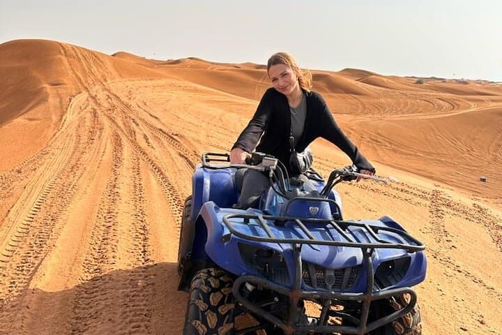 Conquer Dubai's Lahbab Red Dunes: ATV, Sandboarding & Camel Ride