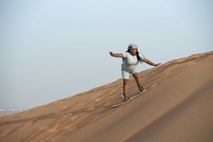 Conquer Dubai's Lahbab Red Dunes: ATV, Sandboarding & Camel Ride photo 4