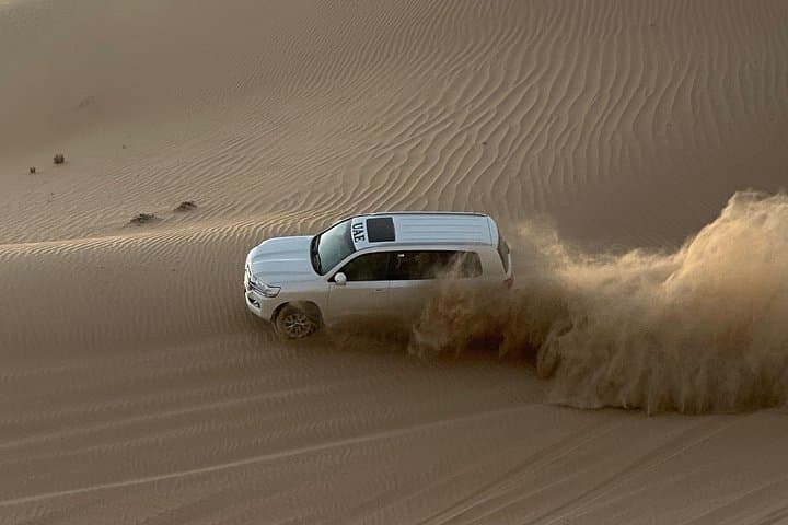 Abu Dhabi Morning Desert Safari: 4-Hour Dune Bashing, Camel Ride & Sandboarding