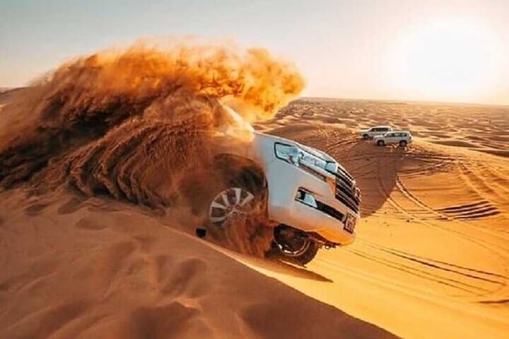 Red Dunes Desert Safari: ATV, Sandboarding, Camel Rides & Evening Show in Dubai photo 2