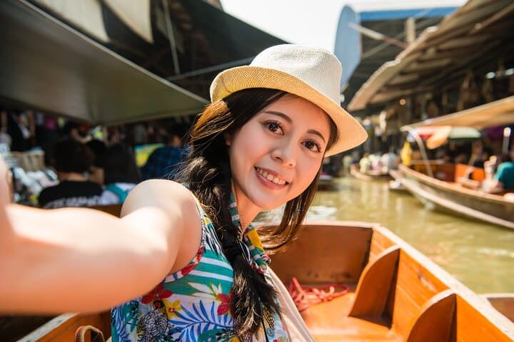From Train Tracks to Emerald Pools: Damnoen Floating Market & Erawan Falls Day Tour photo 6