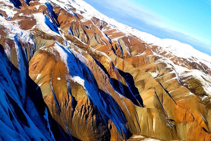 Helicopter Tour Over Iceland: 3 Landings, Geothermal Bath & Golden Circle from Reykjavík