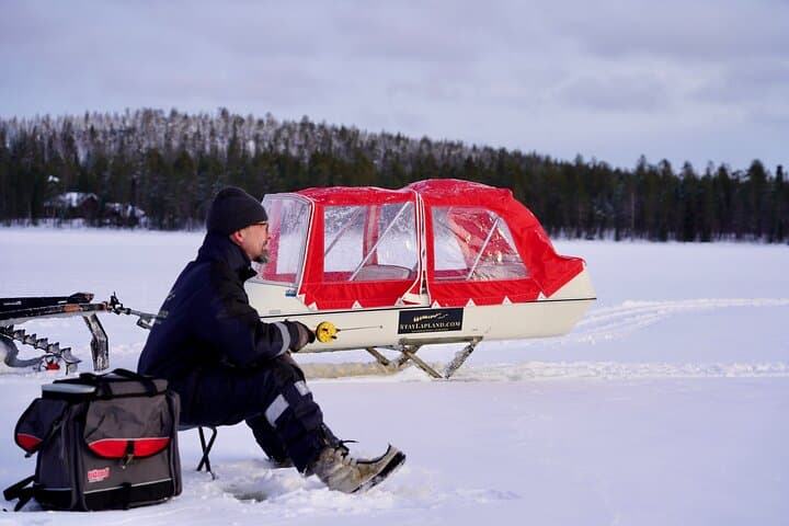 Explore Arctic Wilderness: Ice Fishing and Snowmobiling Adventure in Lapland