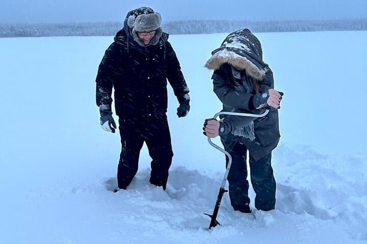 Explore Arctic Wilderness: Ice Fishing and Snowmobiling Adventure in Lapland photo 3