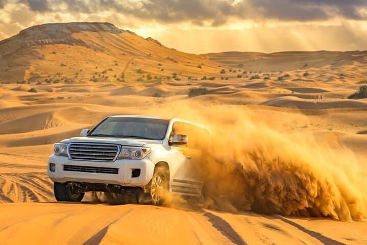 Dubai Evening Desert Safari & BBQ: Dune Bashing, Camel Rides and Live Shows