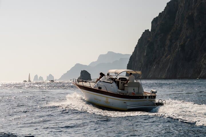 Private Capri Day Cruise: Blue Grotto, Faraglioni & Snorkel from Sorrento photo 1