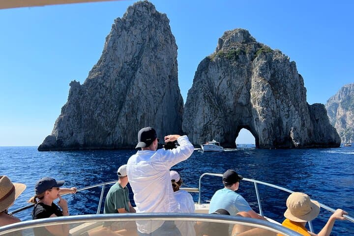 Explore Capri by Boat: Secret Grottos, Faraglioni & Swim Stops photo 6