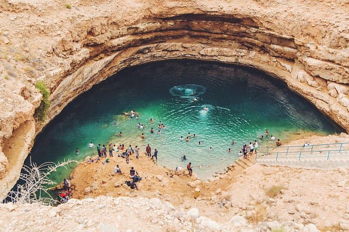 Wadi Shab and Bimmah Sinkhole Day Trip from Muscat — Swim Caves & Turquoise Pools photo 1