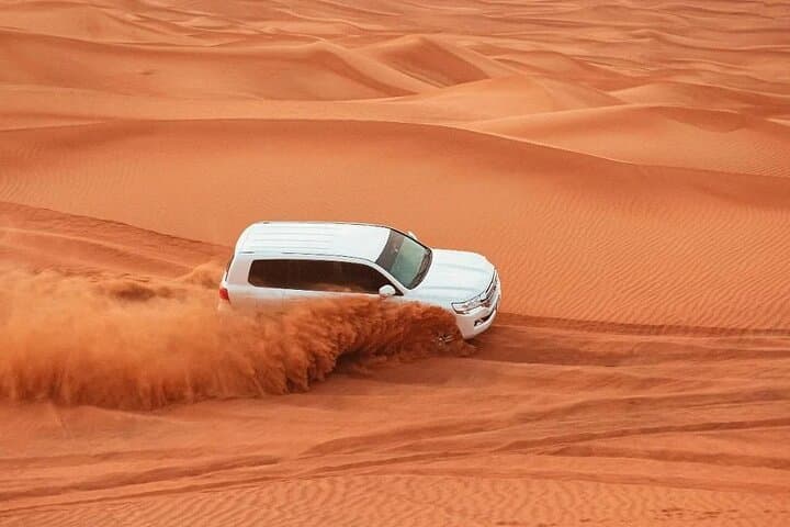 Sunrise Desert Safari: Camel Ride & Quad Bike Adventure in Dubai