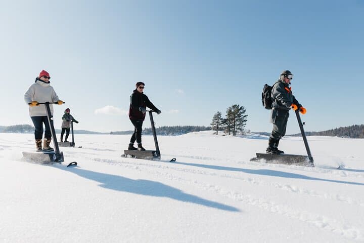 Silent Snow Scooter Safari on Lake Saimaa — Electric Snow Scooters in Finnish Taiga
