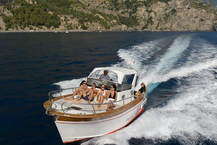 Private Full-Day Capri Boat Tour from Positano — Faraglioni, Grottos & Snorkeling photo 2