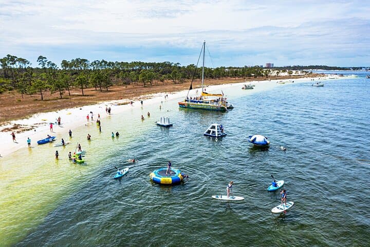 Catamaran to Shell Island: Inflatable Water Park, Snorkel & Dolphin Cruise in Panama City Beach