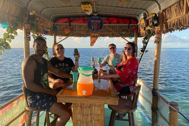 Caye Caulker Tiki Boat Sunset Cruise — Rum Punch, Dolphins & Island Vibes photo 1