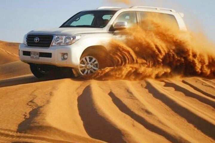 Morning Dubai Desert Safari — 4-Hour Dune Bashing, Sandboarding & Camel Ride photo 1