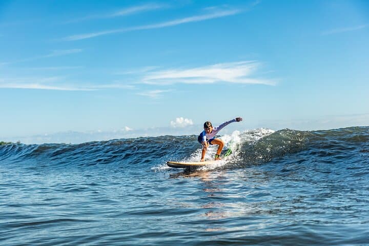 Ride Warm Waves: Group Guided Surfing Lessons on Tahiti's Black-Sand East Coast photo 3