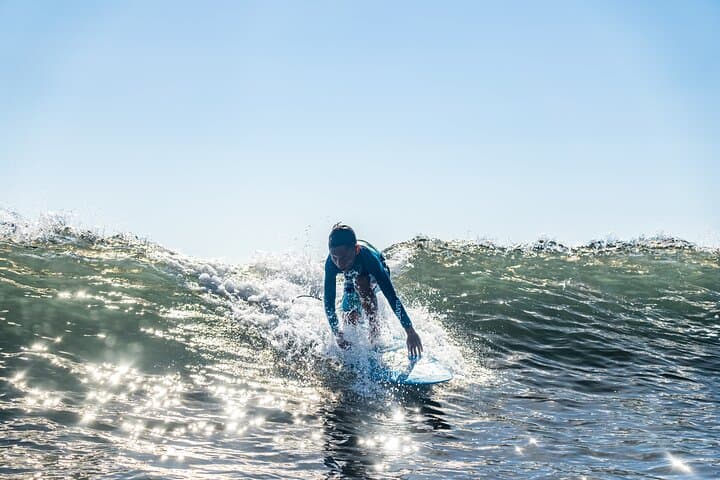 Ride Warm Waves: Group Guided Surfing Lessons on Tahiti's Black-Sand East Coast photo 4
