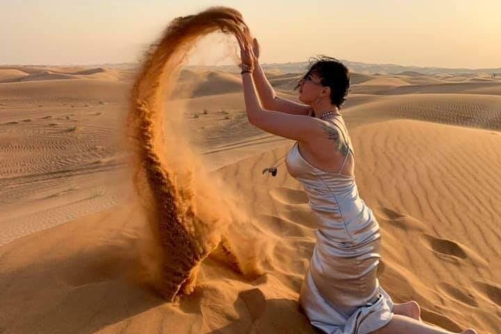 Red Dune Dubai Desert Safari: Sandboarding, Camel Rides & Night Camp Experience photo 2