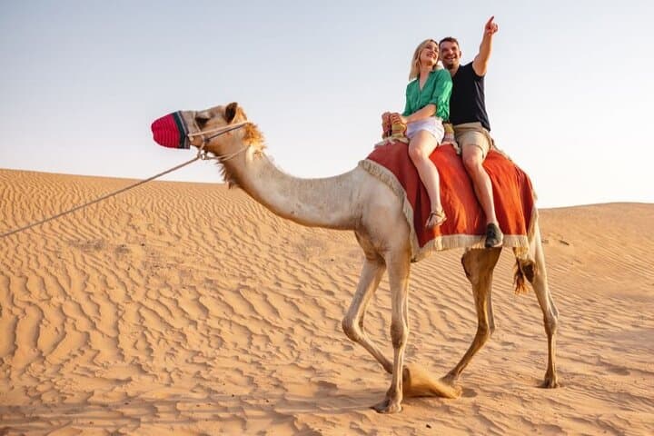 Morning Camel Trek & Sandboarding in Dubai’s Red Dunes — Sunrise Safari with Falcon Photos photo 2