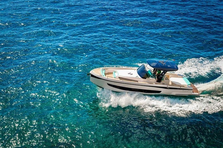 Private Capri Full-Day Boat Tour: Blue Grotto, Faraglioni & Coastal Villas photo 2
