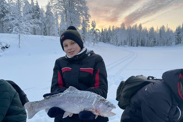 Ice Fishing and Snowshoeing on a Private Pond in Lapland — Day Trip from Tornio