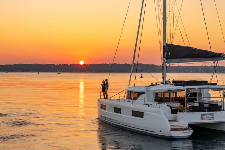 Sailing Milos to Poliegos: Full-Day Catamaran Cruise with BBQ, Snorkel & SUP