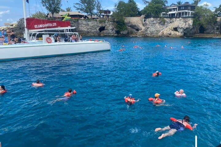 Sunset Catamaran, Snorkel & Bamboo Rafting with Limestone Massage in Jamaica photo 4