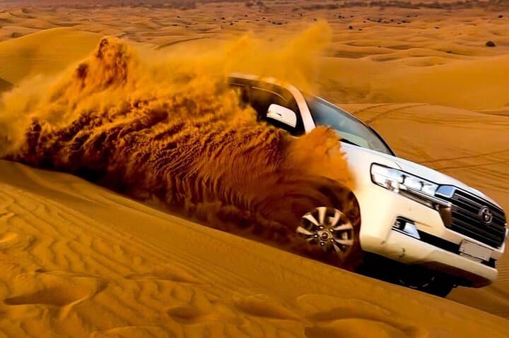 Red Dune Morning Safari: Dune Bashing, Sandboarding & Camel Ride