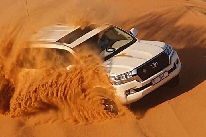 Evening Dubai Desert Safari with BBQ, Dune Bashing & Live Shows