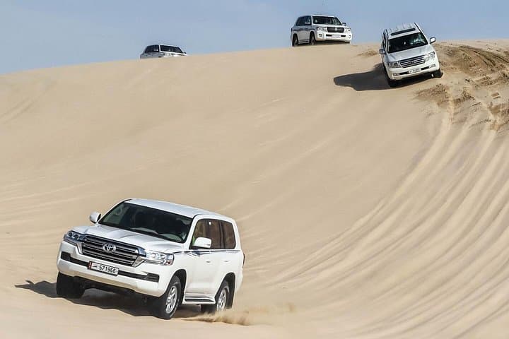 Sealine Desert Safari: Half-Day Dune Bashing, Camel Ride & Inland Sea Views photo 1