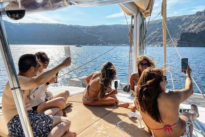Santorini Sunset Catamaran Cruise: Red Beach, Hot Springs & Dinner photo 4