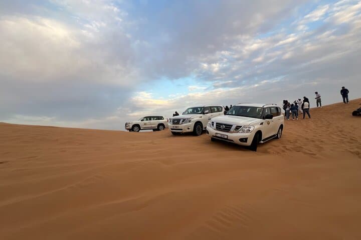 Morning Red Dune Desert Safari: Camel Ride & Sandboarding in Lahbab