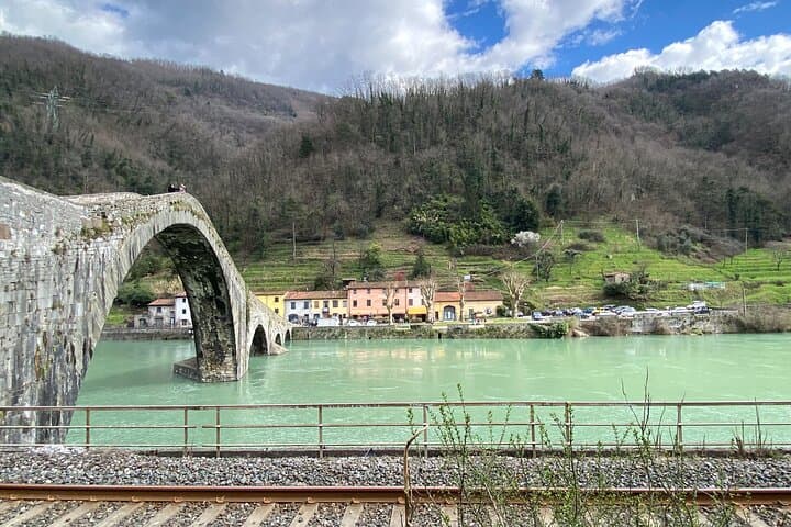 Explore Garfagnana: Devil's Bridge, Cheese Tasting & Medieval Barga from Lucca
