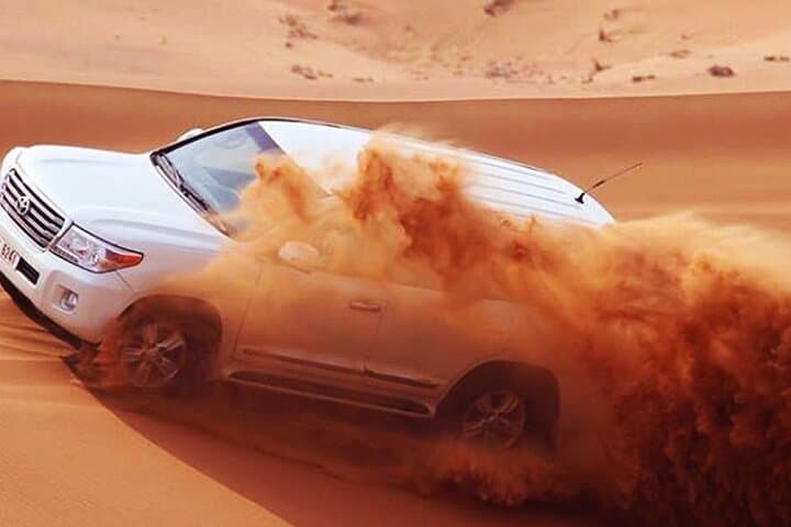 Dubai Red Dune Evening Safari: Dune Bashing, Camel Rides & BBQ Under the Stars photo 2