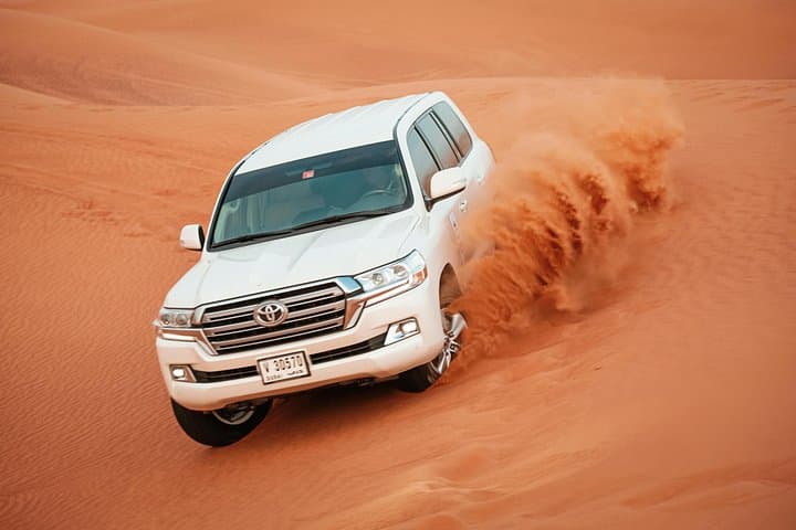 Abu Dhabi Desert Safari with BBQ Dinner: Dune Bashing, Camel Rides & Bedouin Camp
