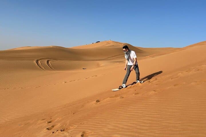 Dubai Red Dune Desert Safari: Camel Ride, Sandboarding & BBQ in Lahbab photo 6