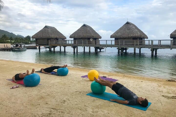 Sunrise Beach Yoga at Manava Moorea — 90-Minute Group Class photo 2