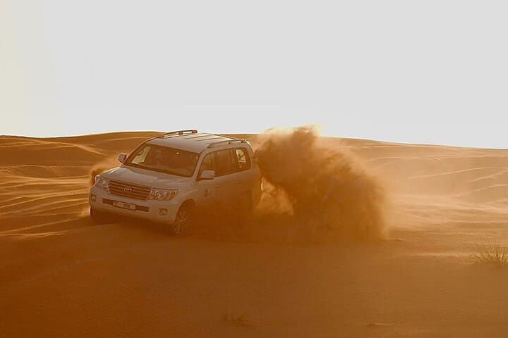 Dubai Evening Desert Safari: Lahbab Dune Bashing, Sandboarding & BBQ Experience